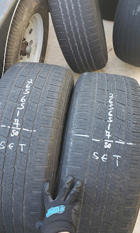 Marked and sized used tires ready for installation at Used Tires